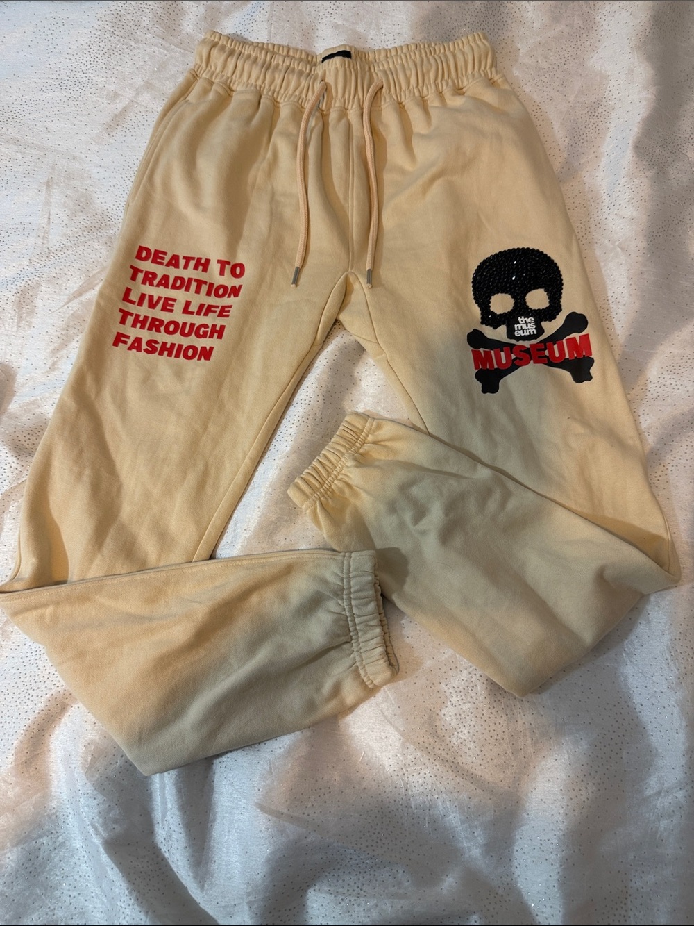 The Museum Graphic Kids Sweatpants in Cream with Red and Black Prints